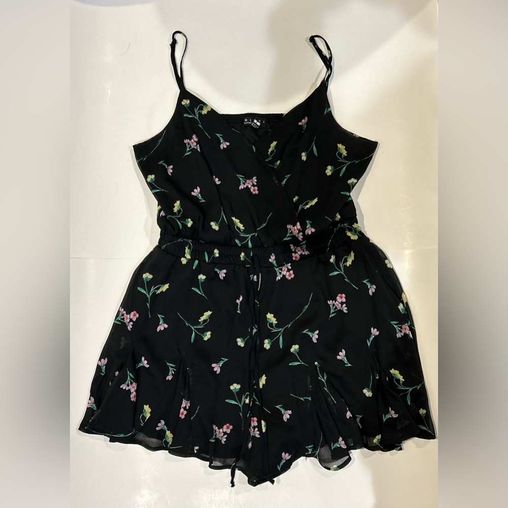 Black flowy romper with floral patterning